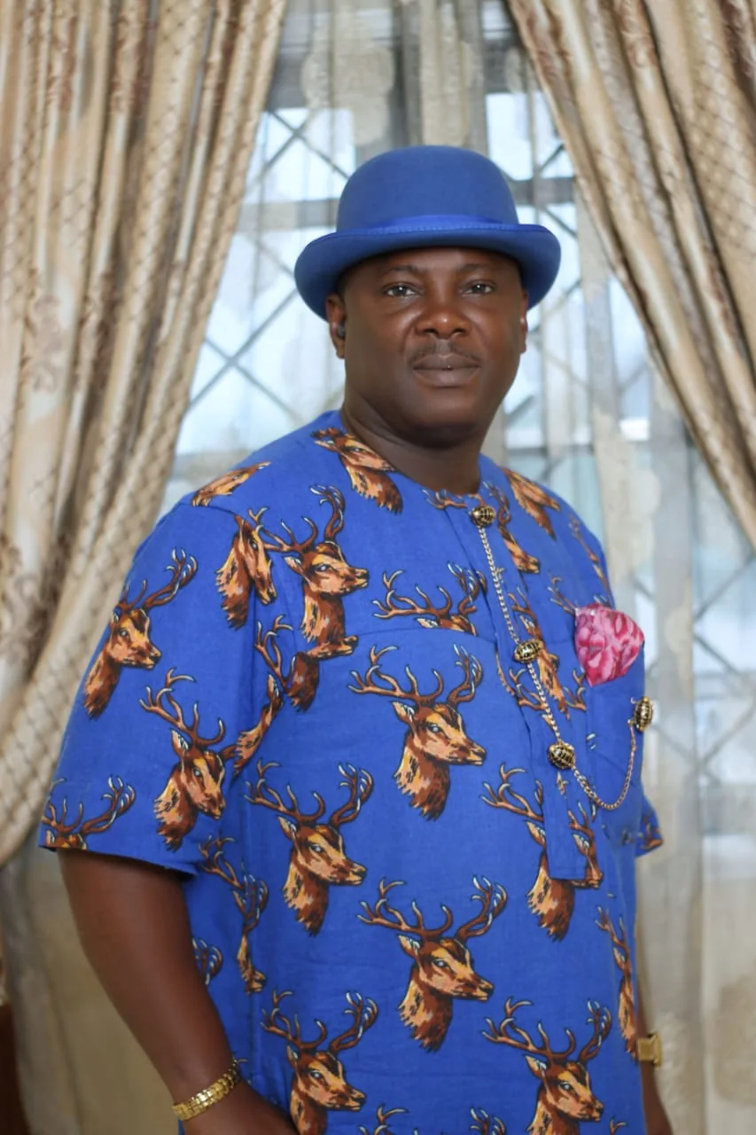 Jonathan Robinson Obuebite in blue traditional attire